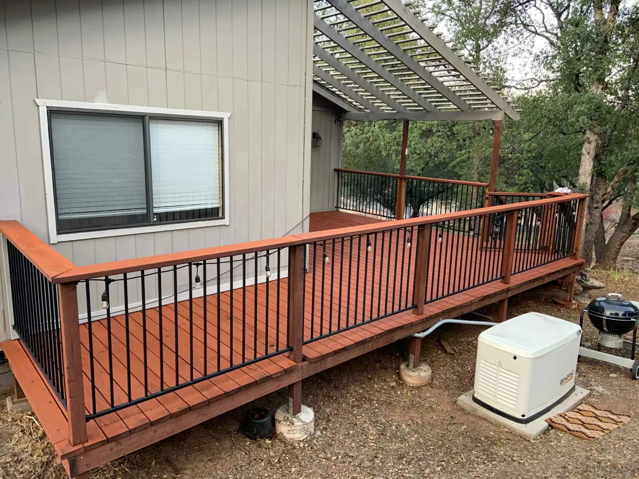 a colored wooden deck that is freshly stained.